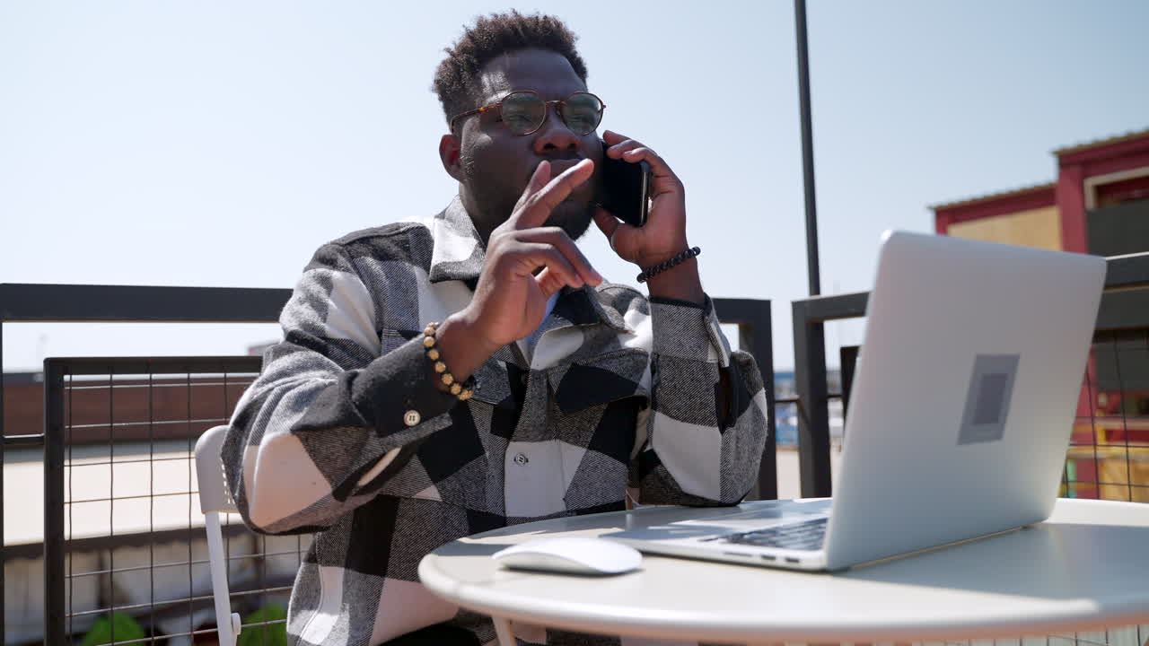Businessman working outdoors on a laptop