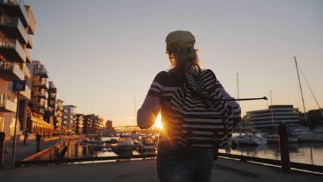 Active-Woman-Rejoices-At-Sunrise-Over-The-Marina-Runs-Forward-Raises-His-Hands-Up-Sunrise-In-Bergen