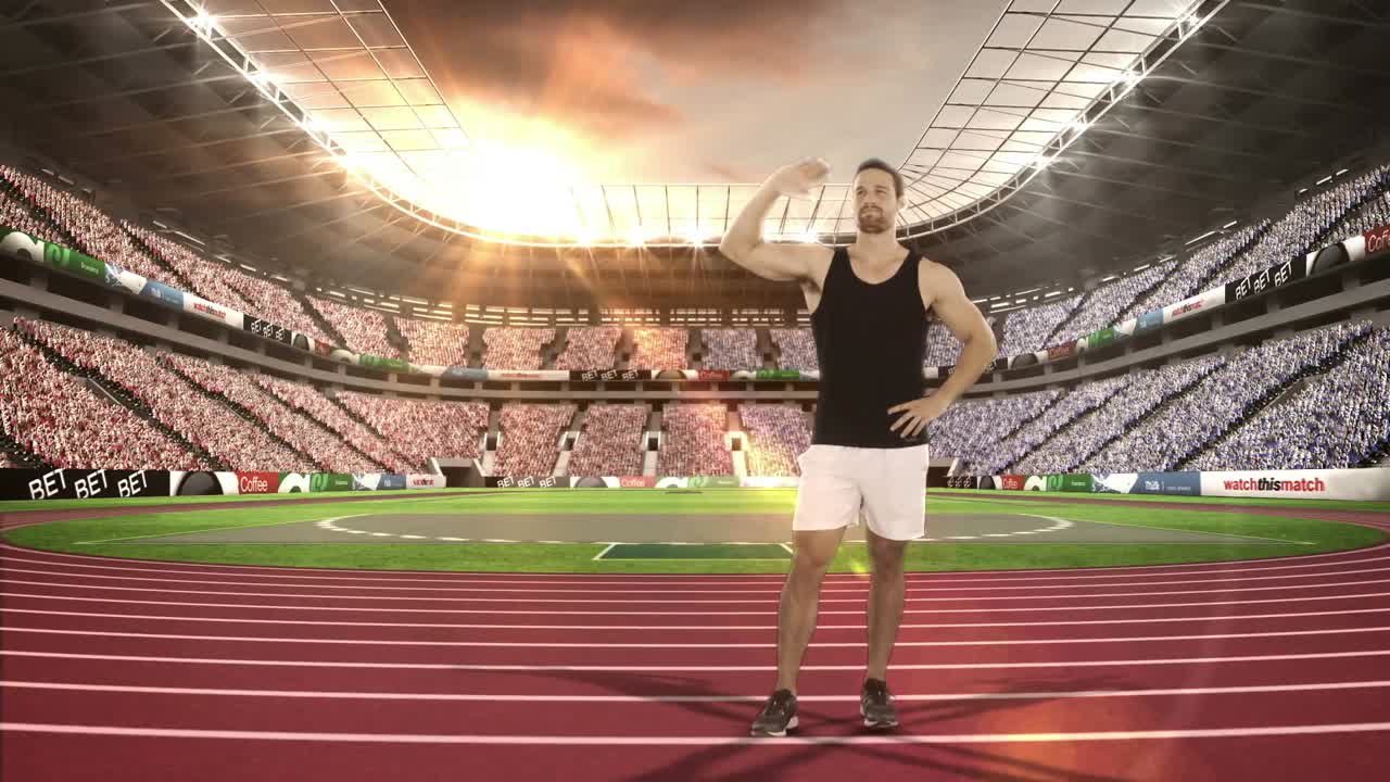 atleta masculino agitando las manos a los espectadores