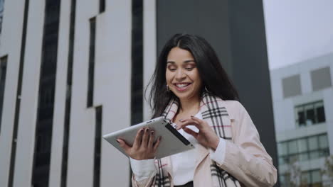 businesswoman receiving good news on tablet. winner girl celebrating victory