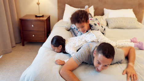 Father,-excited-kids-and-play-in-bedroom-with-dad