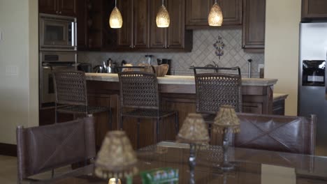 living room next to kitchen with table and chairs, decorations