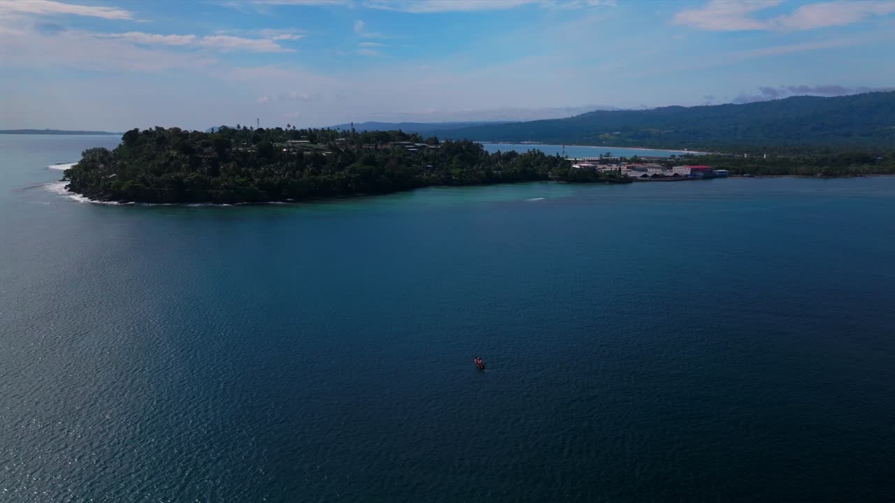 Wewak Papua New Guinea PNG aerial drone Wewak Hill dry season town Seawall Mini Beach Dogreto Bay Sundaun Market Boram Road Memorial drive costal cape fishing boat canoe cargo vessel circle left