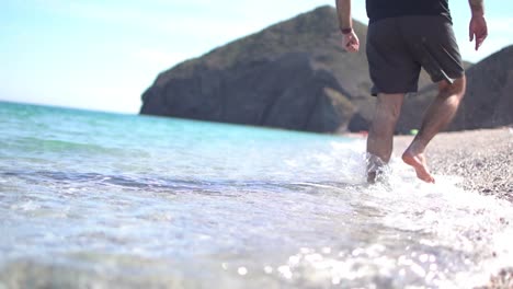 Seashore,-coastline,-scenic-view-of-people-at-unspoiled-beach-in-Almeria,-called-Playa-de-los-Muertos,-in-English-The-beach-of-Deads-due-to-the-strong-currents-that-cause-many-deaths-year-after-year