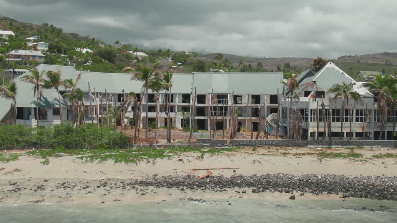 4K Aerial Abandoned hotel on the beach Drone dolly in