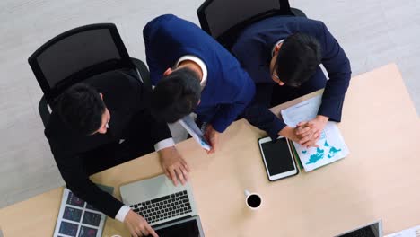 Business-people-group-meeting-shot-from-top-view