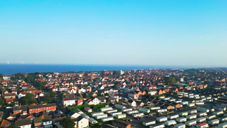 embark on an aerial journey over skegness's holiday parks, witnessing caravans, holiday homes, and the idyllic countryside on a summer evening