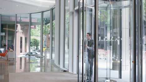 crazy happy businessman dancing in corporate lobby