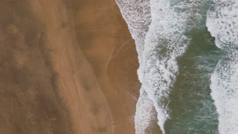 Aerial-top-angle-view-of-a-deserted-sandy-paradise-beach