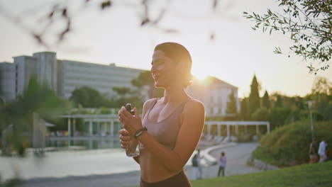 tired lady replenishing water balance fitness workout at evening nature closeup