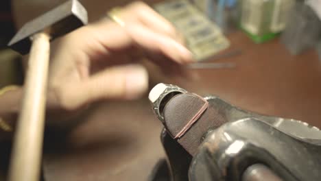 jeweler at work in jewelry. desktop for craft jewelry making with professional tools. close up view of tools.