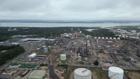 Pull-back-drone-aerial-reverse-reveal-Fawley-Oil-Refinery-Hampshire-UK-drone,aerial-pull-back-drone-aerial-reverse-reveal