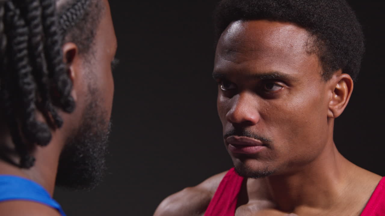 Close Up Of Male Boxer And Opponent Standing Face To Face Before Boxing Match Staring At Each Other 5