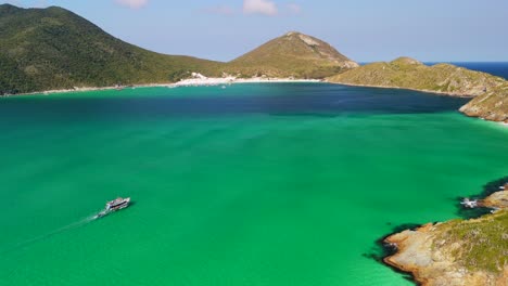 aerial view of arraial do cabo beach, solely boat sail on south atlanitc east coast