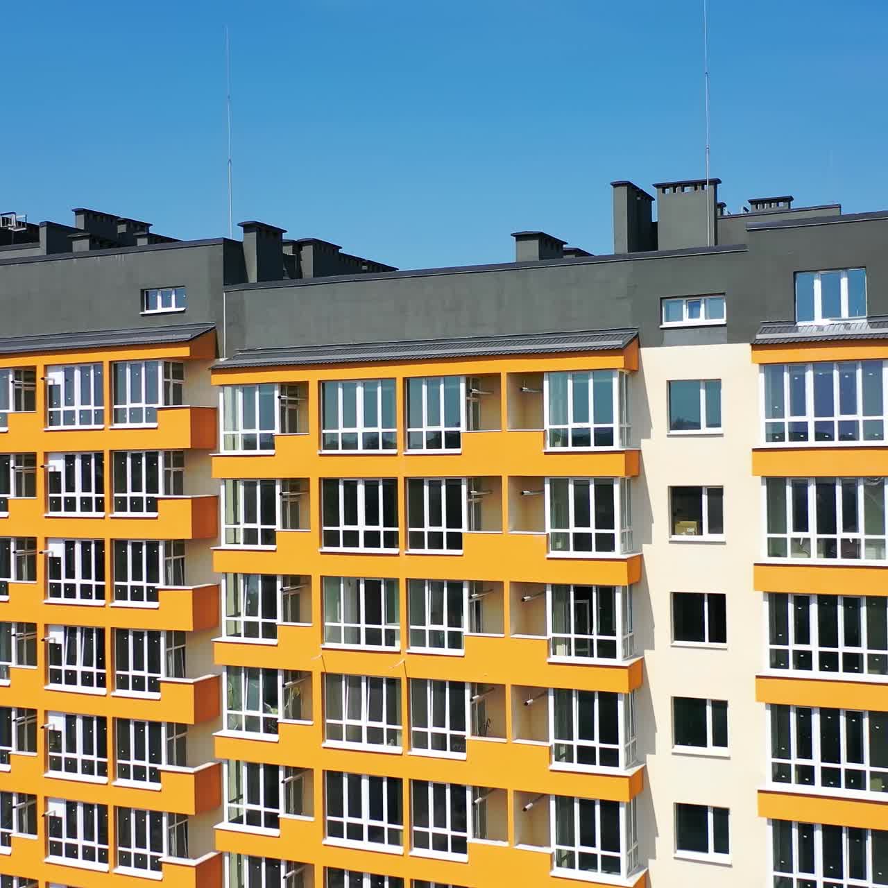 Street of modern residential district. Exterior of new high-rise multi story apartment building