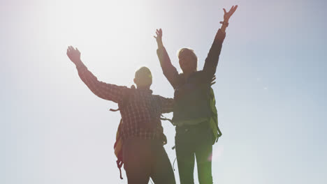 Happy-active-senior-couple-on-mountains