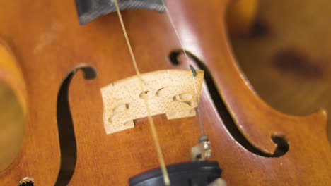 Wooden-old-violin-revealed-in-a-smood-tilting-slow-motion