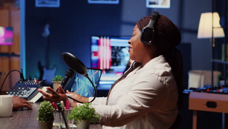 internet show host speaking with guest during live broadcast, listening to her opinion