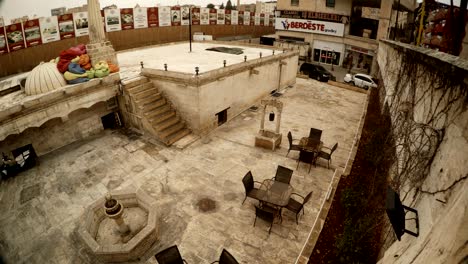 agreeable empty restourant with small old well in stone city sanliurfa