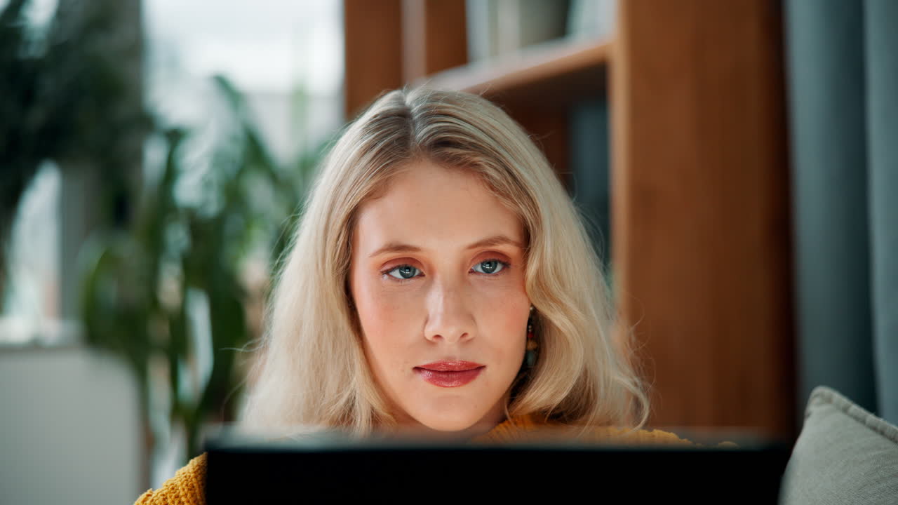 Woman with blonde hair using laptop