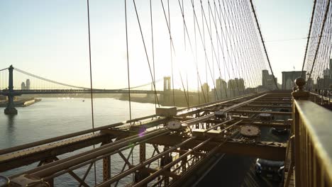 manhattan bridge as seen from the brooklyn bridge with suspension cables in background