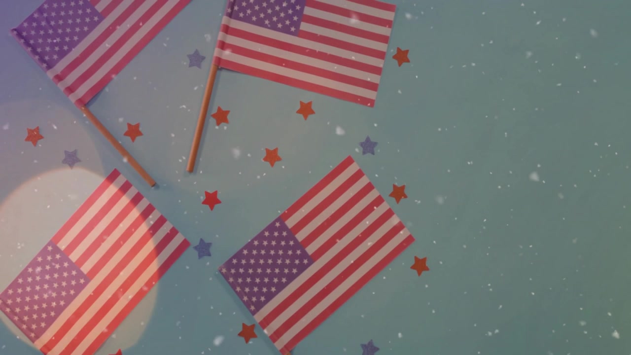Bokeh circle emerging causing particles drifting around US flags over turquoise surface for decor