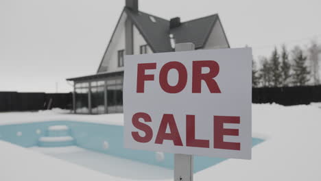 for sale banner on a house