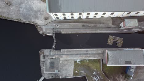 water sluice top down aerial view from telemark channel in skien norway - skien sluice birdseye view while slowly mowing upwards