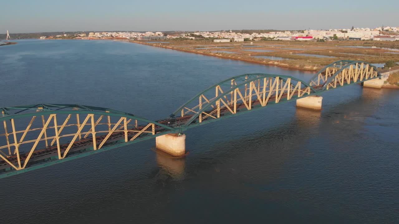 Portimao Railway Bridge, aerial pan right of a bridge in Portugal over the Arade river