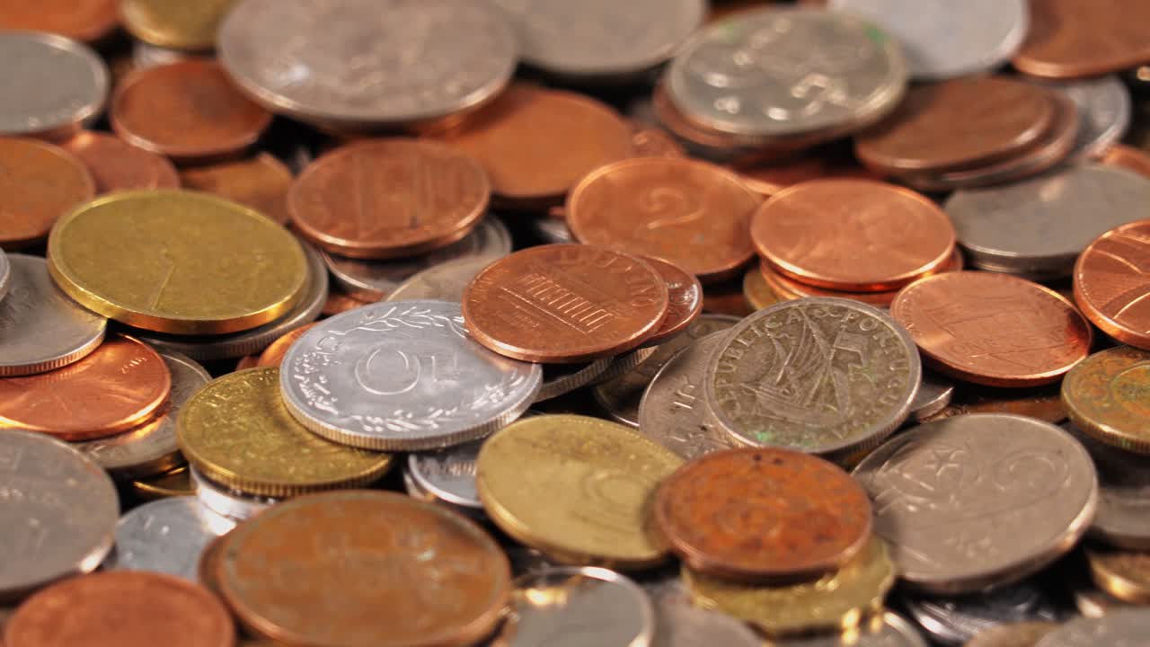 Different types of coins placed closely together on a flat surface