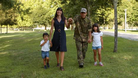 happy military man and his family enjoying leisure time