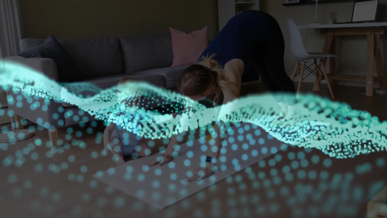 Mother guiding baby into yoga pose on home mats initiating health animation with blue-green dots