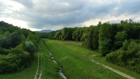 Lake-Butoniga-Croatia-water-canal-tributary-system-with-low-flow,-Aerial-drone-low-flyover-shot