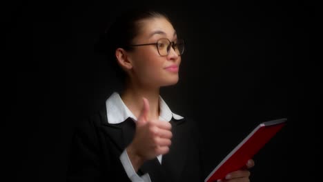 business woman reads the document, agrees and gives a thumbs up.