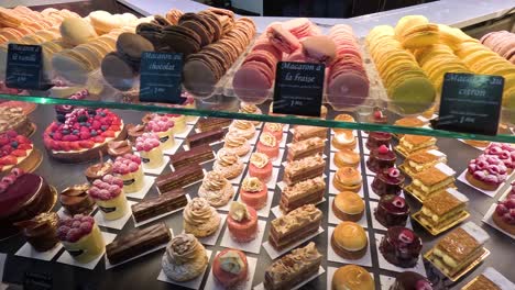 assorted pastries and desserts in a bakery