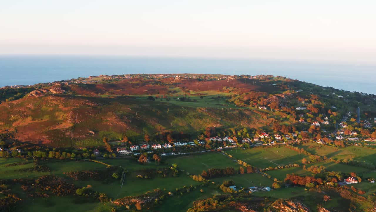 Aerial Orbit of Howth Sutton South with Evening Light on Shielmartin Hill and Surrounding Homes