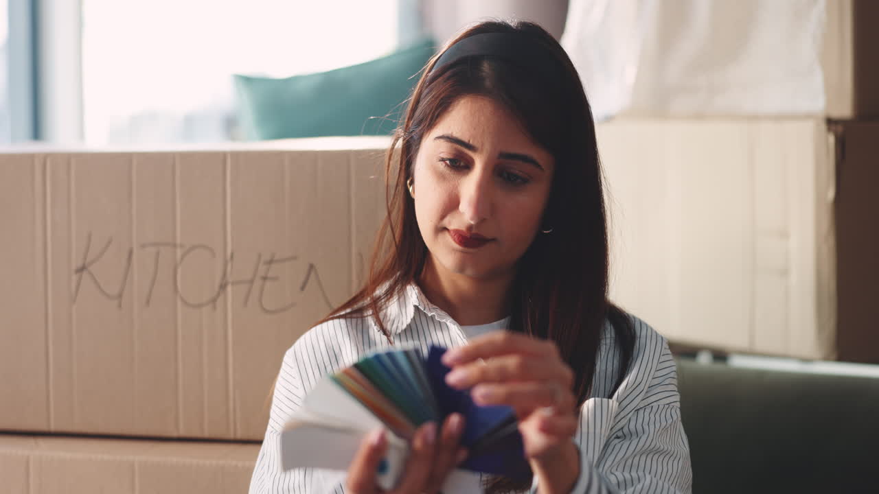 Woman Choosing Paint Colors for New Home