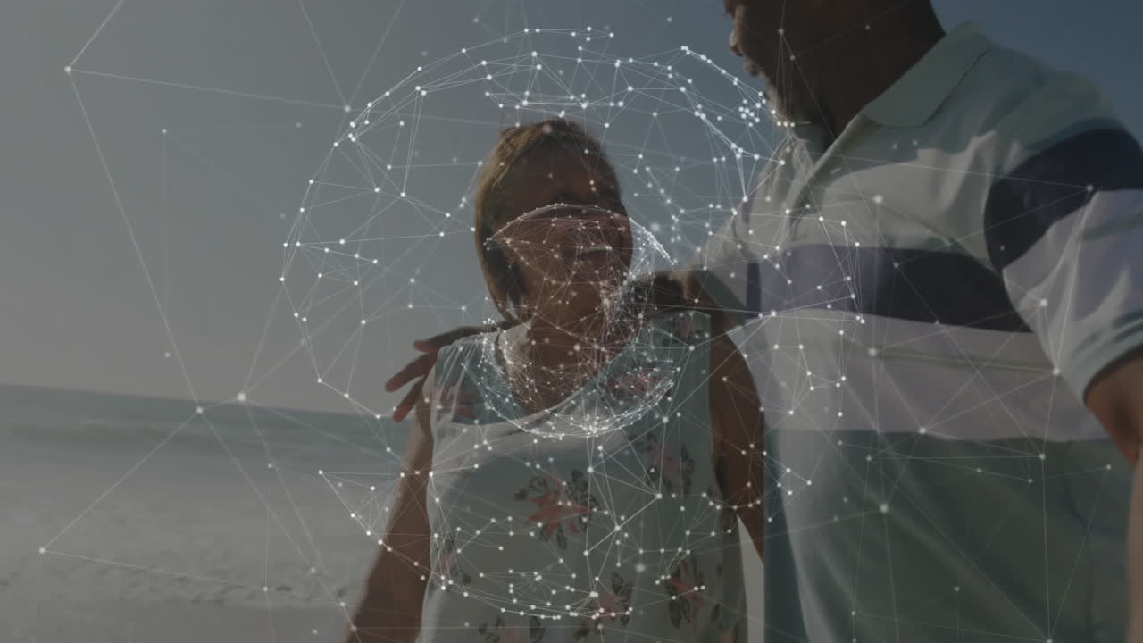 Couple walking on beach with network of connections animation overlay