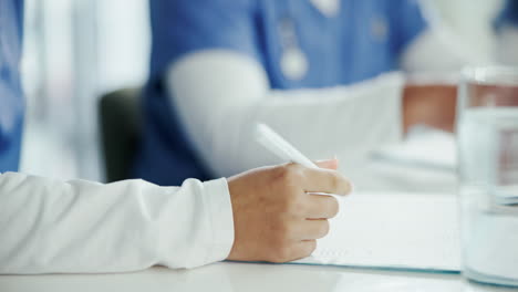 doctors and nurses meeting to discuss a patient's case.