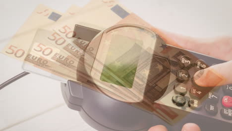 animation of euro banknotes falling over hand of caucasian man holding payment terminal