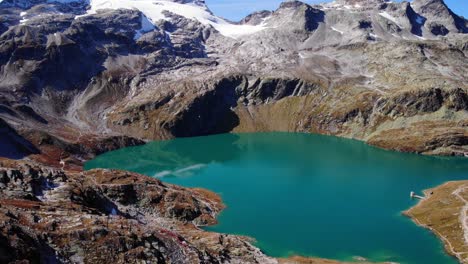 Beautiful-blue-mountain-lake-in-Weissee,-Austria--Aerial