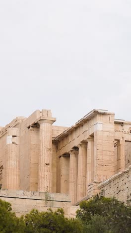 ancient structure surrounded by trees and tourists