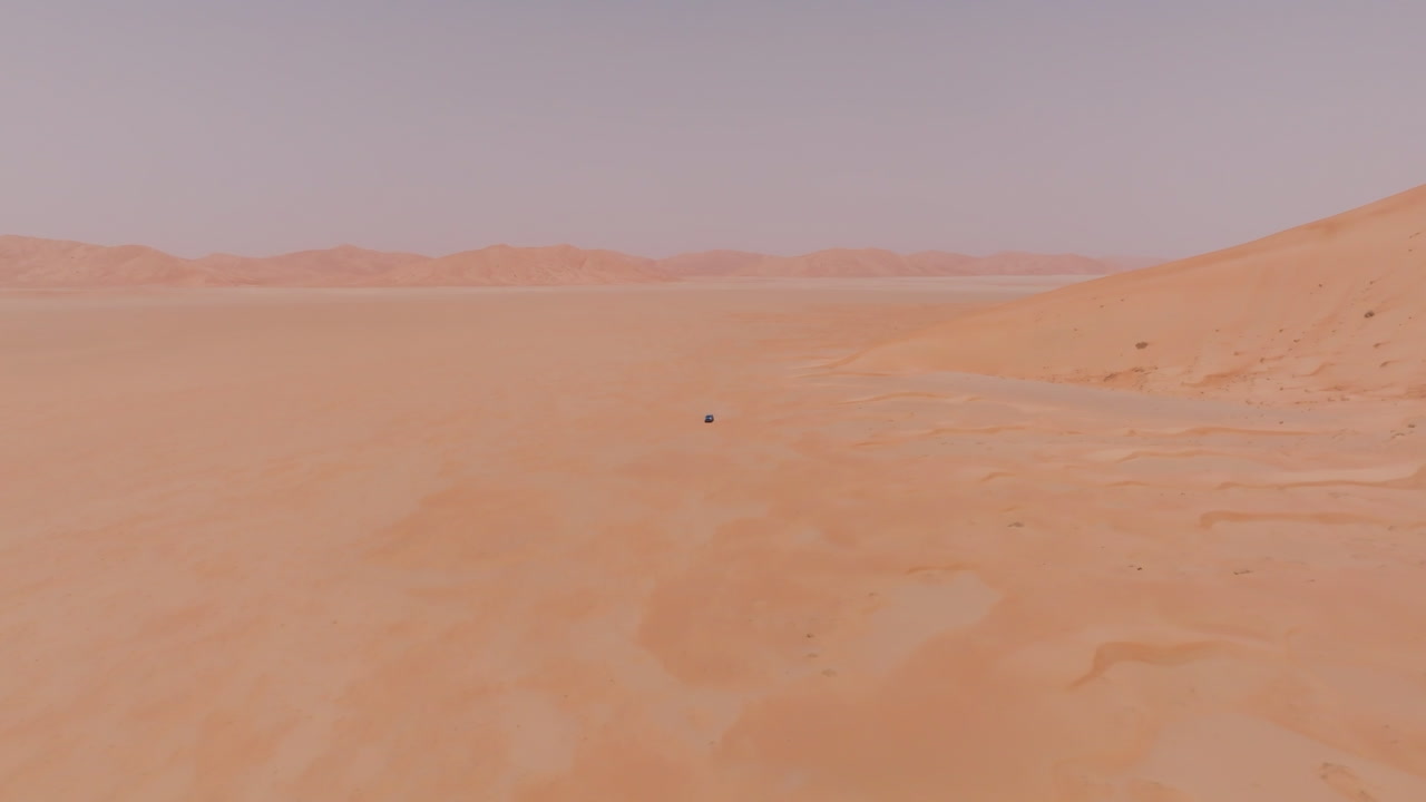 The endless, hot expanse of The Empty Quarters desert in Oman under extreme heat