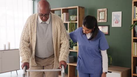 elderly man using walker with assistance from caregiver