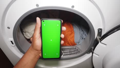 phone showing green screen inside a dryer