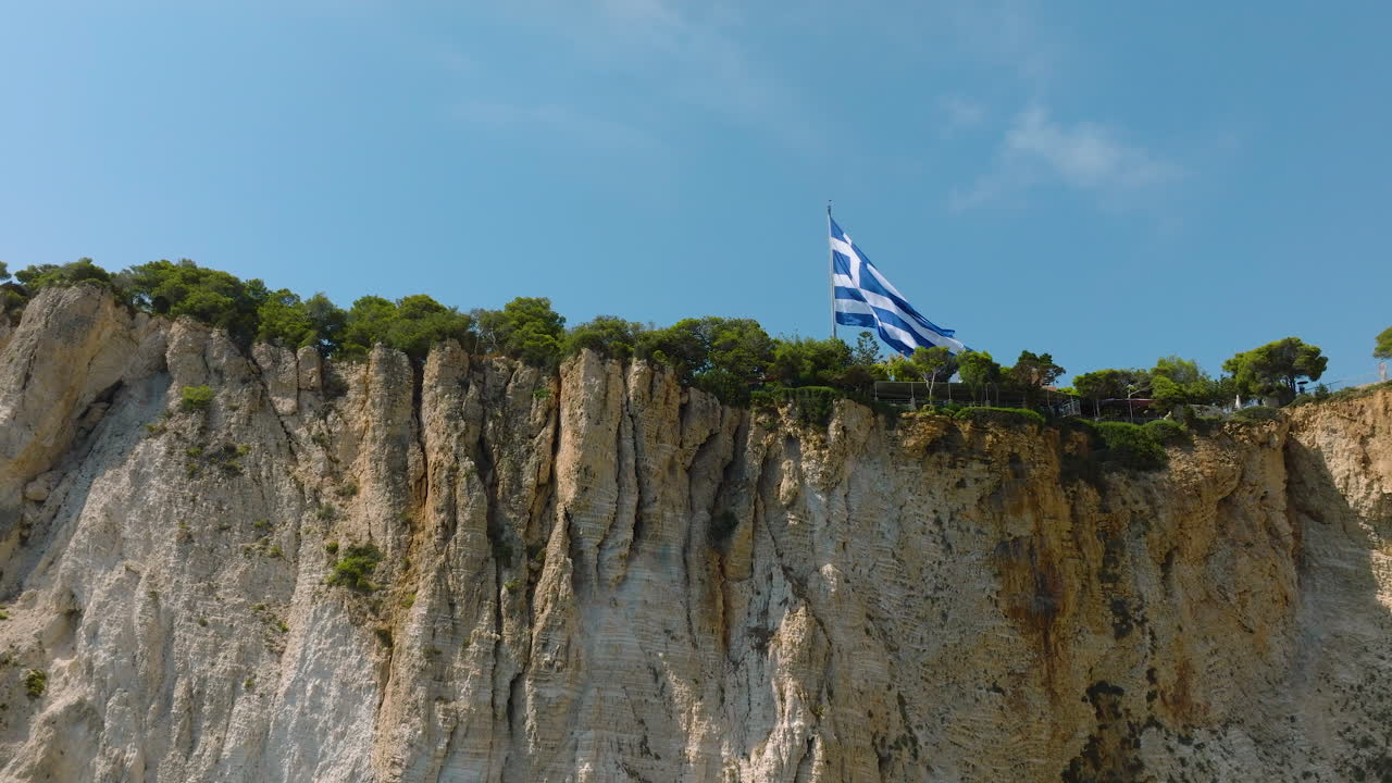 Greek Flag on Cliffside