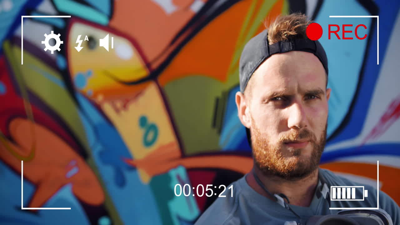 filmando a un hombre y graffiti en una cámara digital 4k