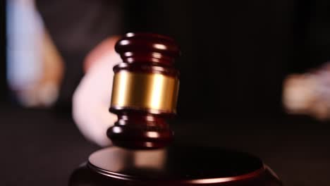 this is a close-up of the hammer striking the court, symbolizing both justice and legal authority in the courtroom