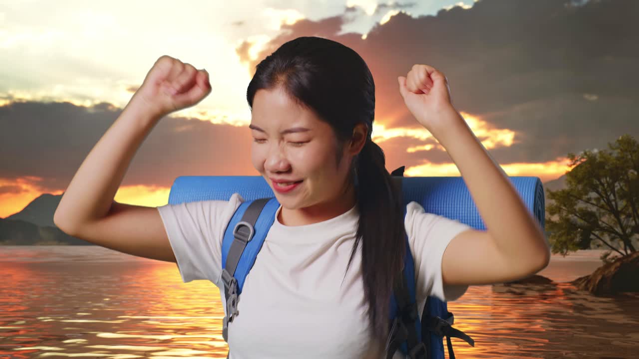 Happy Woman Hiking at Sunset by the Lake