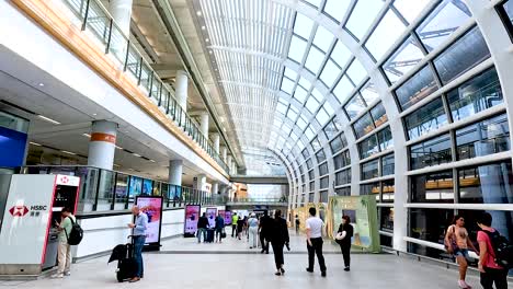 travelers walking through a modern airport terminal